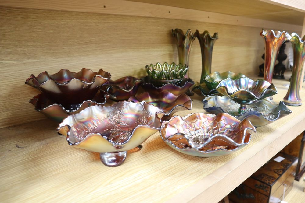 A quantity of mixed green and orange Carnival glass dishes and vases